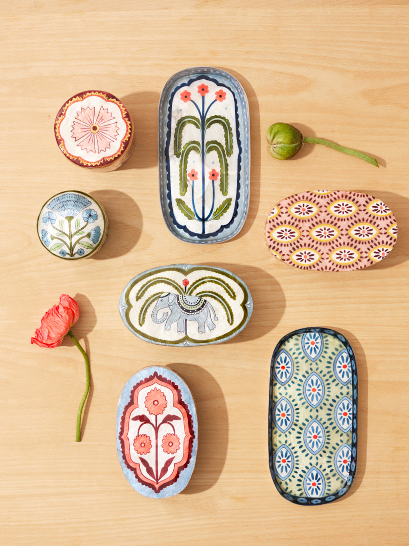 Botanical capiz shell tray styled with perfume and jewellery on a vanity