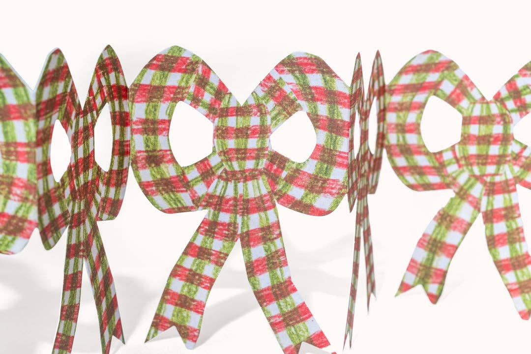 Hadley pink chequer concertina Christmas bow card standing open as a paper decoration detail