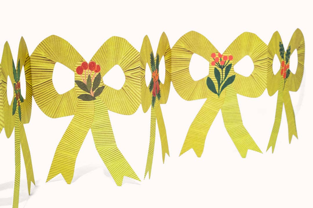 Hadley Christmas bow concertina card with hand painted botanical patterns, standing open on a shelf