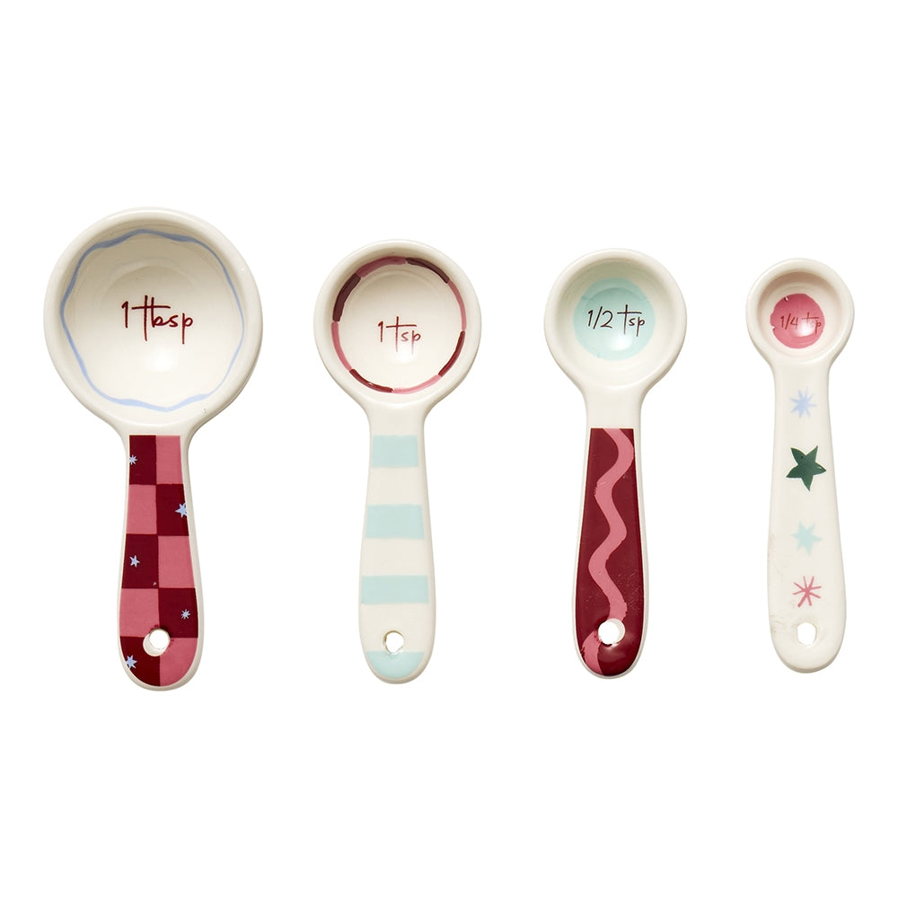Four Christmas print stoneware measuring spoons in red, pink and green