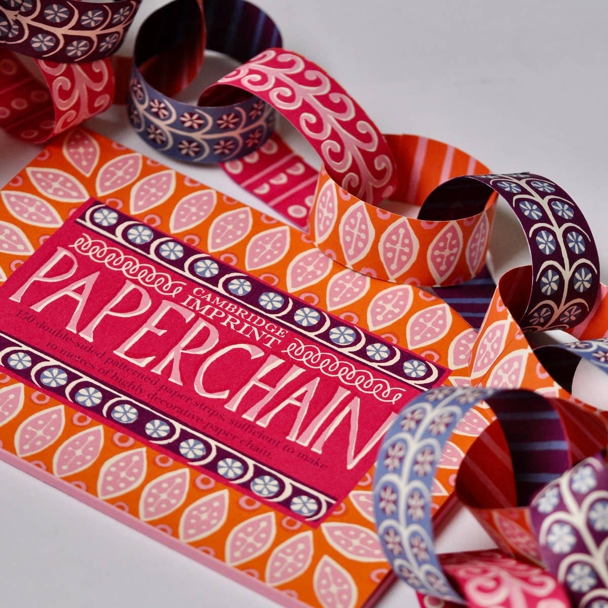 Cambridge Imprint paperchain kit 4 with patterned paper strips and finished paperchain, view 3