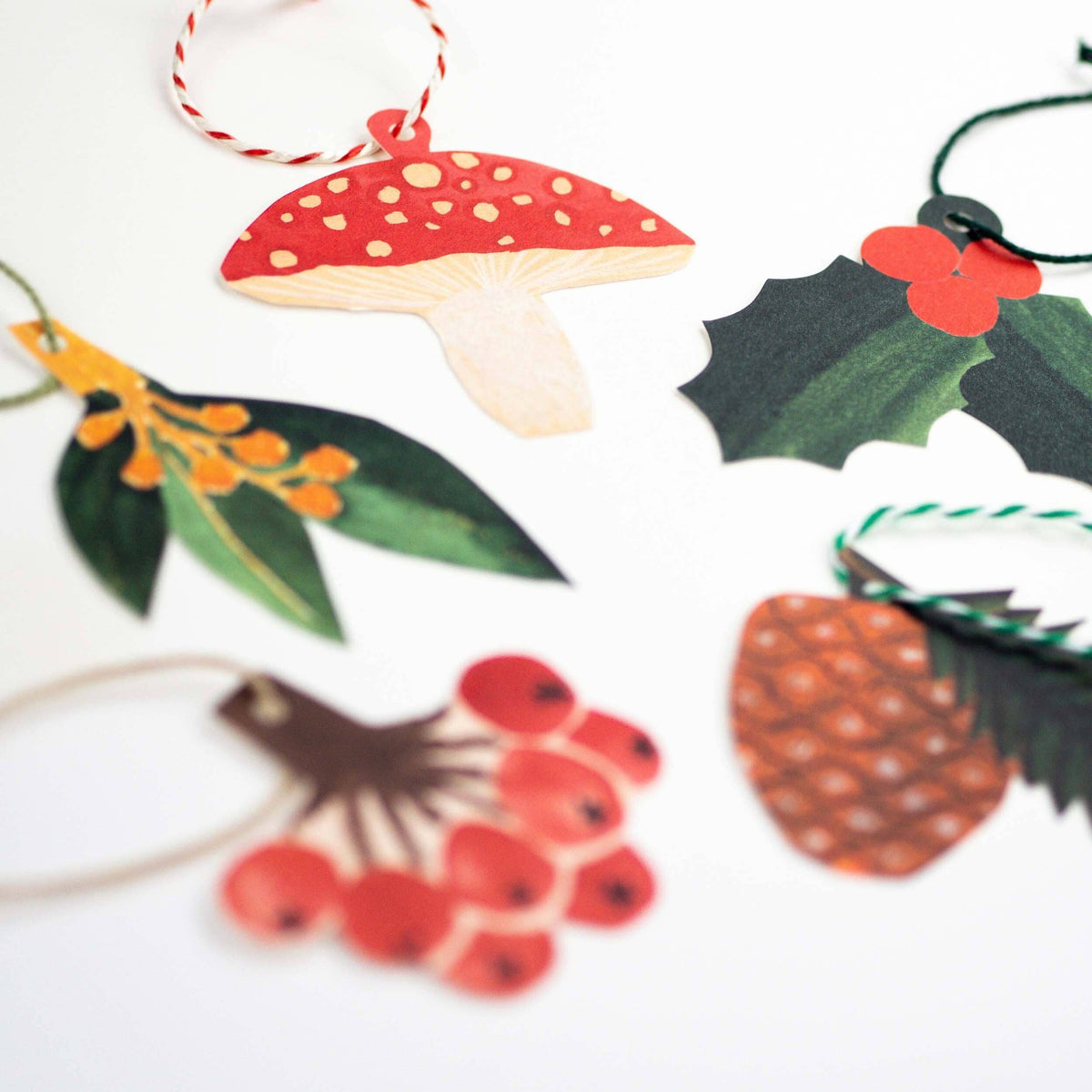 Set of five Hadley collaged festive gift tags with coloured string detail
