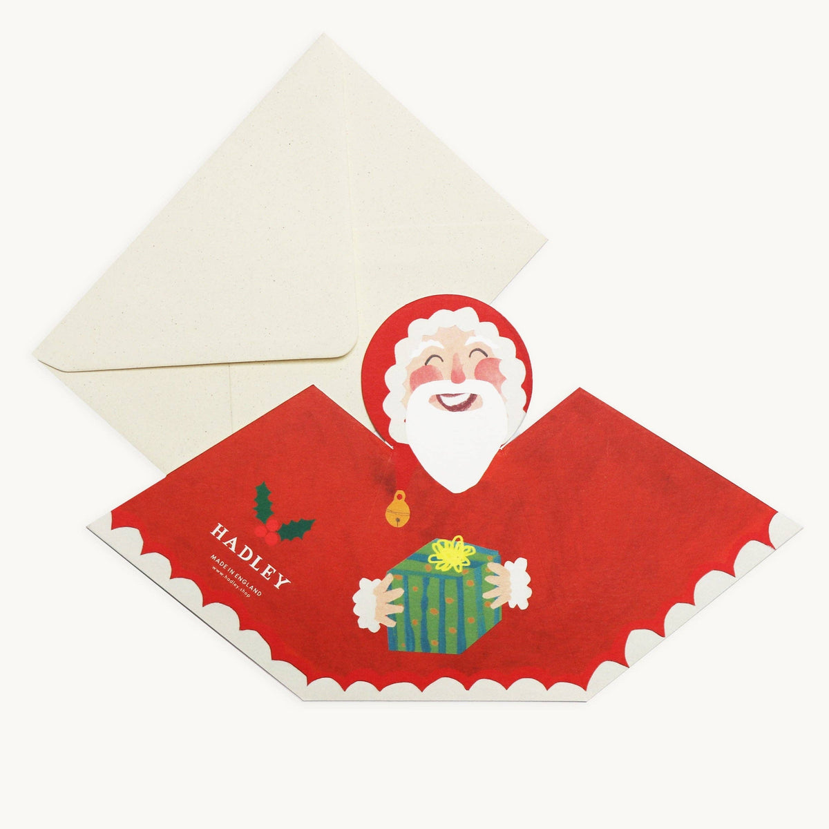 Hadley hand painted Santa Claus stand up Christmas card carrying a gift detail