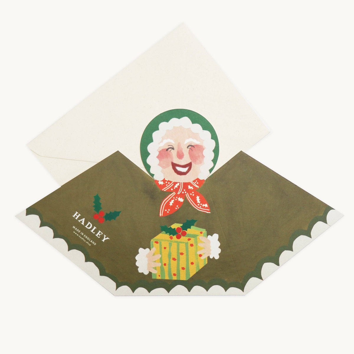 Hadley hand painted Mrs Claus stand up Christmas card holding a wrapped gift detail