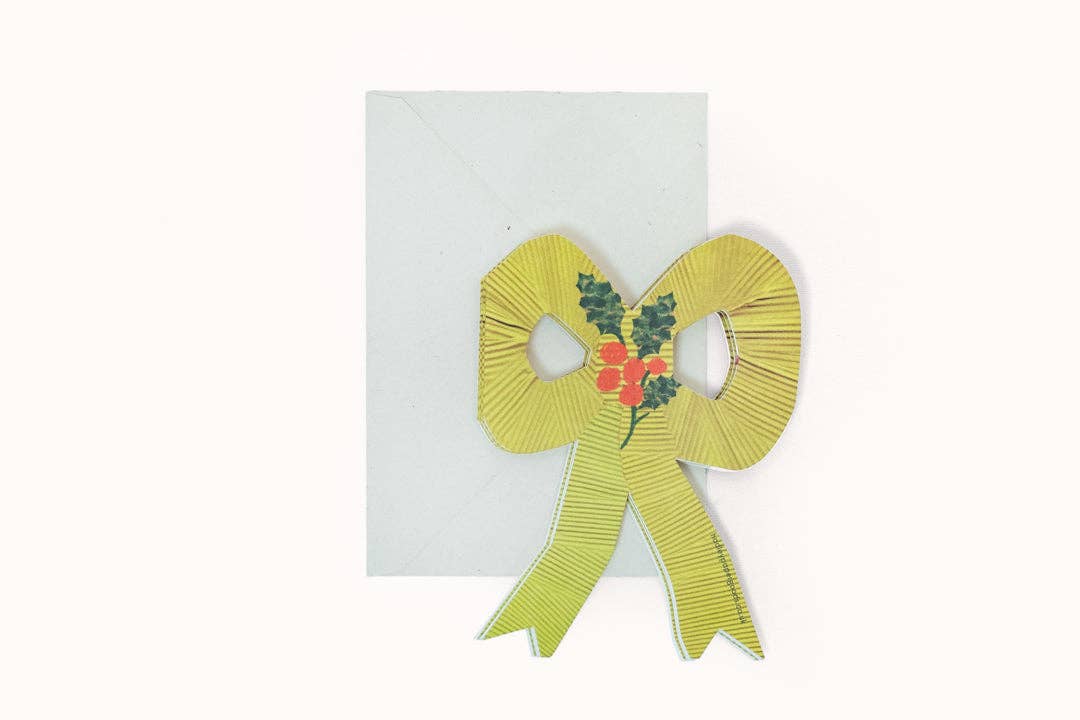 Hadley Christmas bow concertina card with hand painted botanical patterns, standing open on a shelf detail