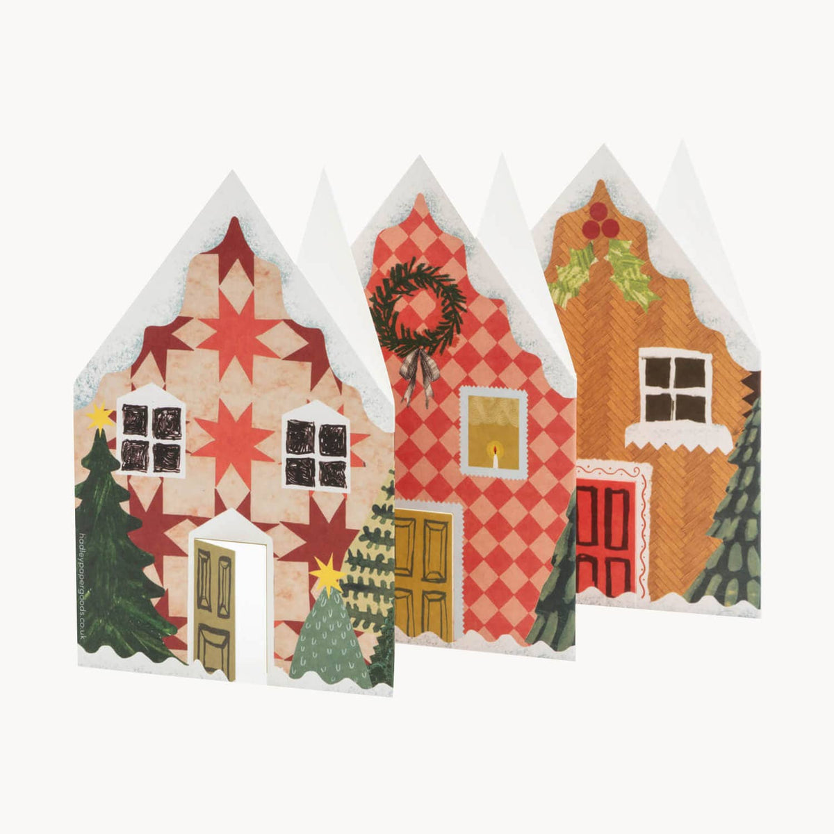 Hadley concertina card unfolded into a row of snowy Scandi style Christmas houses detail