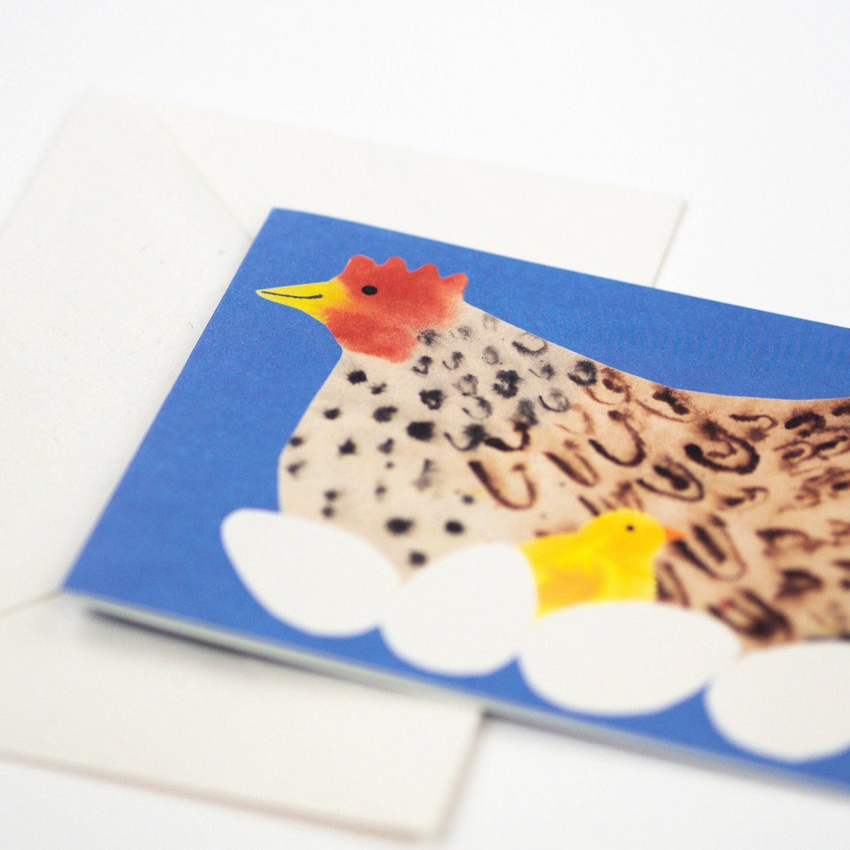 Hadley greeting card of a plump hen with her chick and a clutch of eggs detail