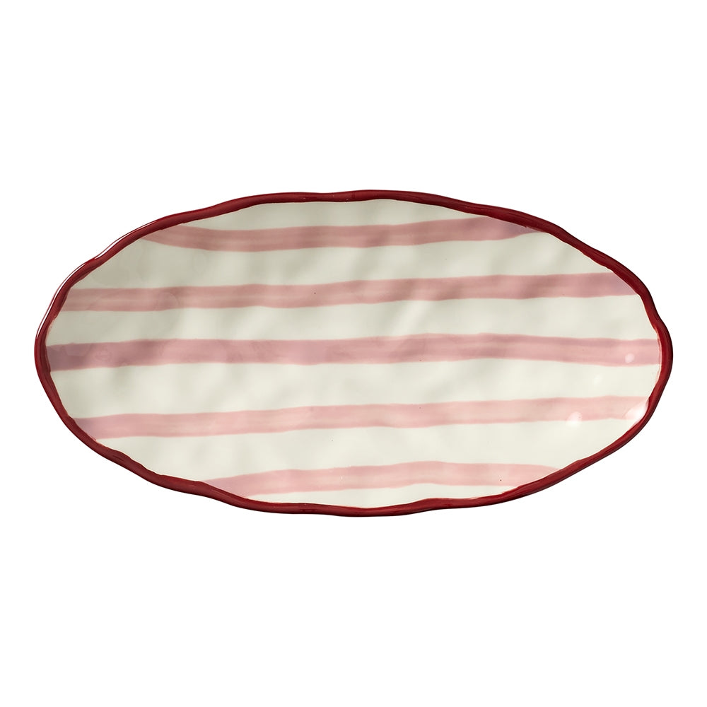 Oval stoneware platter with red stripes, a maroon rim and dimpled texture