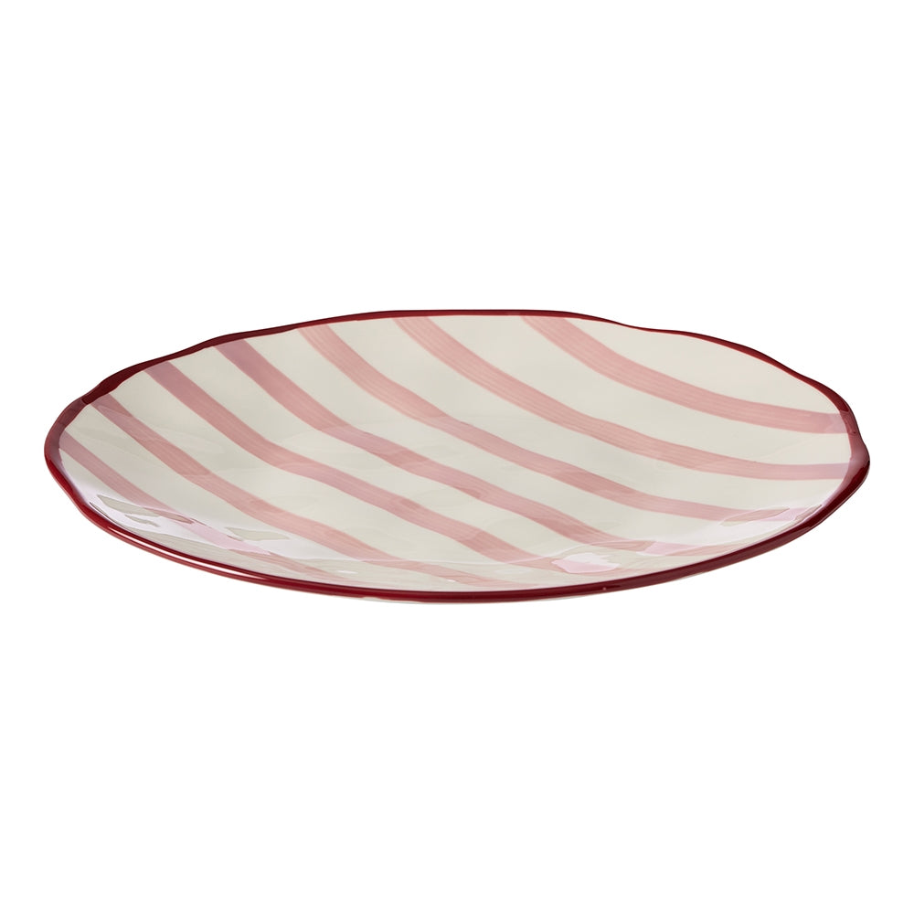 Round stoneware platter with red stripes, a maroon rim and dimpled texture