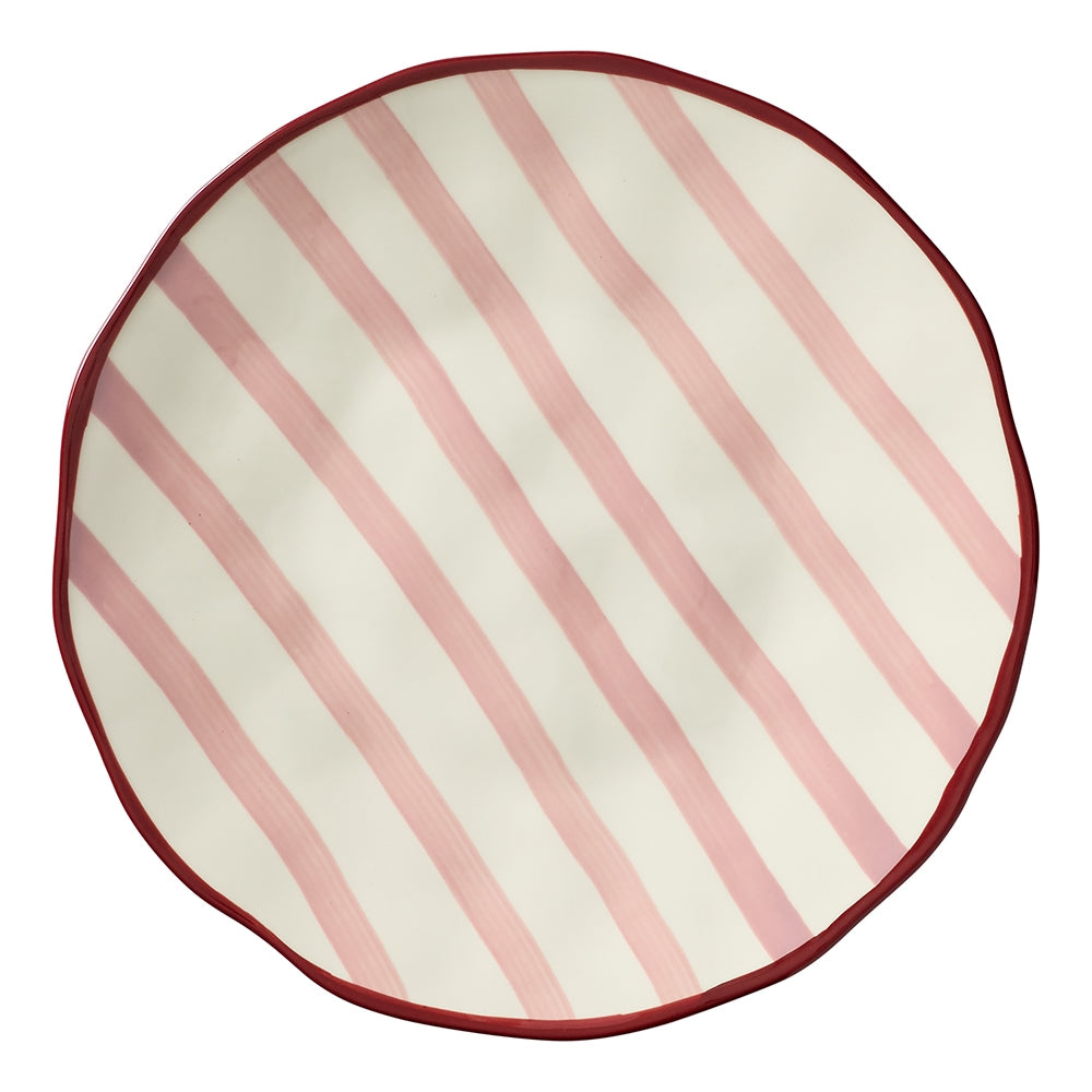 Round stoneware platter with red stripes, a maroon rim and dimpled texture