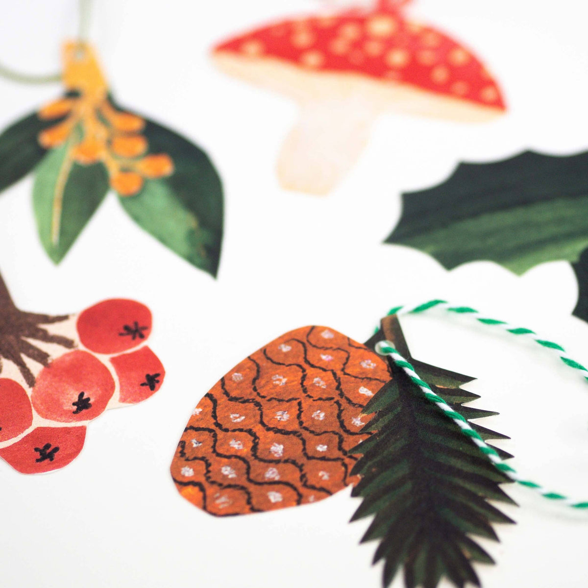 Set of five Hadley collaged festive gift tags with coloured string detail