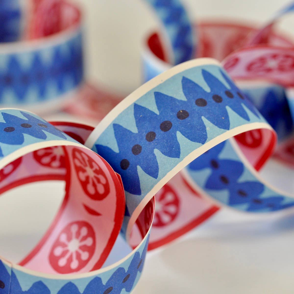 Cambridge Imprint pink and blue paperchain kit with patterned paper strips and finished paperchain, view 3