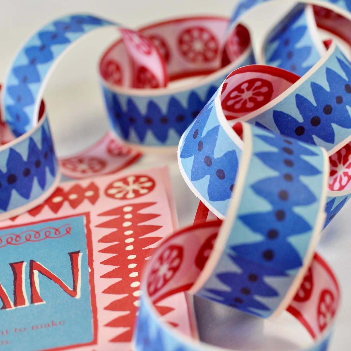Cambridge Imprint pink and blue paperchain kit with patterned paper strips and finished paperchain